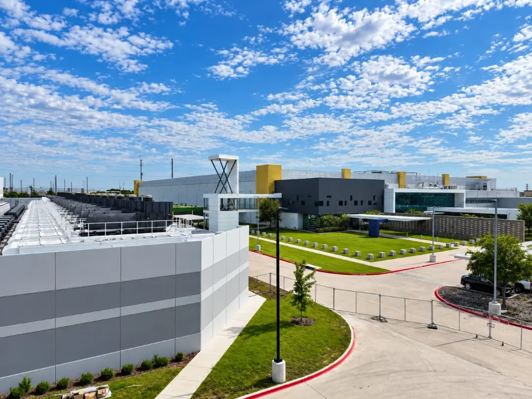 Data center campus under a bright summer sky